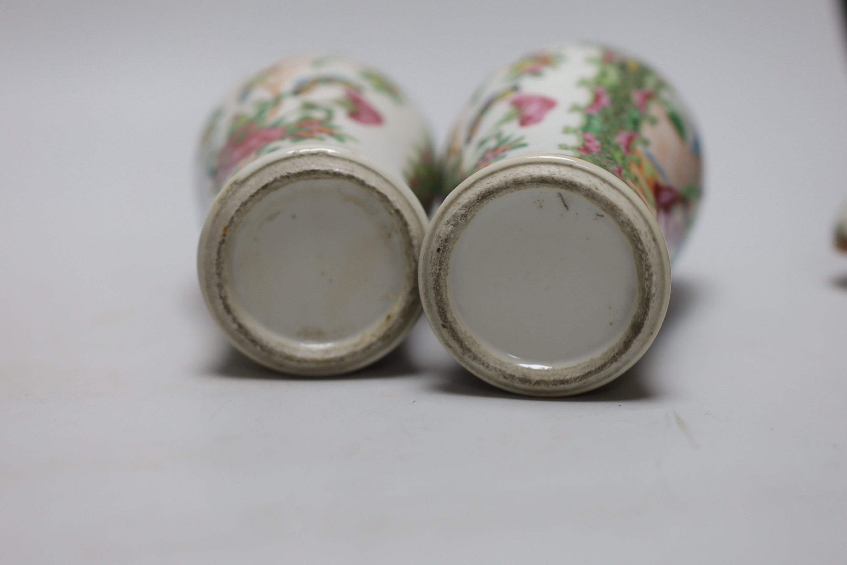 A pair of 19th century Chinese famille rose vases and covers, 24cms high
